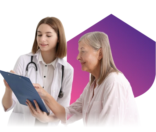A young female doctor is holding a clipboard and discussing it with an older woman who is attentively pointing at the document.