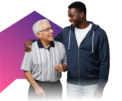 A young man and an elderly man, smiling warmly at each other, stand together against a black background with a pink and purple geometric shape.