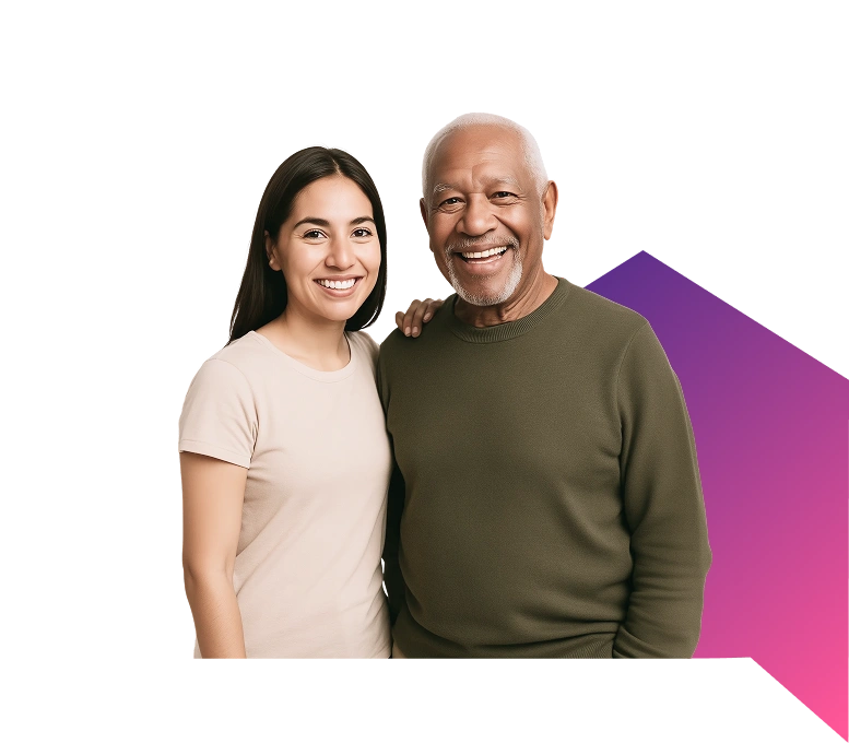 A smiling young woman in a beige shirt stands beside an older man in a green sweater, arms around each other, on a black and purple gradient background.