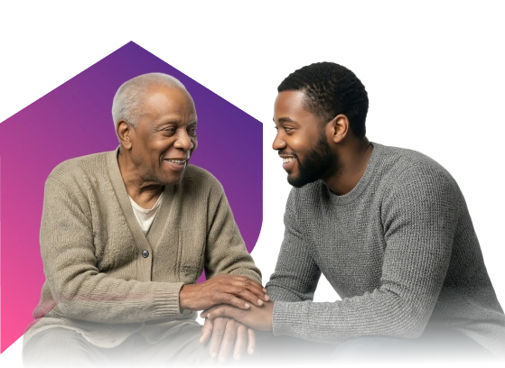 An elderly man and a younger man, both smiling warmly, sit closely, holding hands. The background is a gradient of purple and pink, evoking a sense of unity.