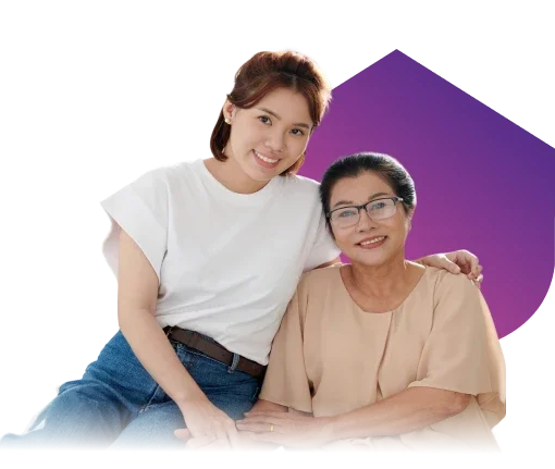 Smiling caregiver and senior woman with glasses posing together against a purple graphic background